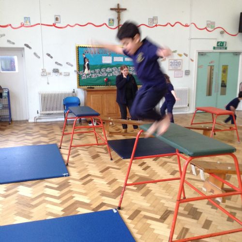 In Gymnastics we have been learning how to safely jump off of different height apparatus, make a simple shape in the air and land safely.